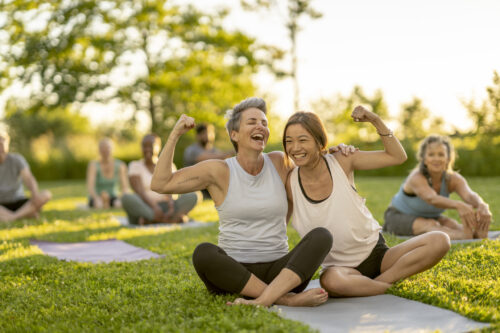 women doing yoga in the park